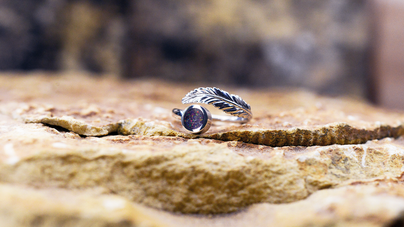 Angel Feather Ladies Ashes Ring Cast in sterling silver filled with lavender opals blended with customers loved one’s ashes.