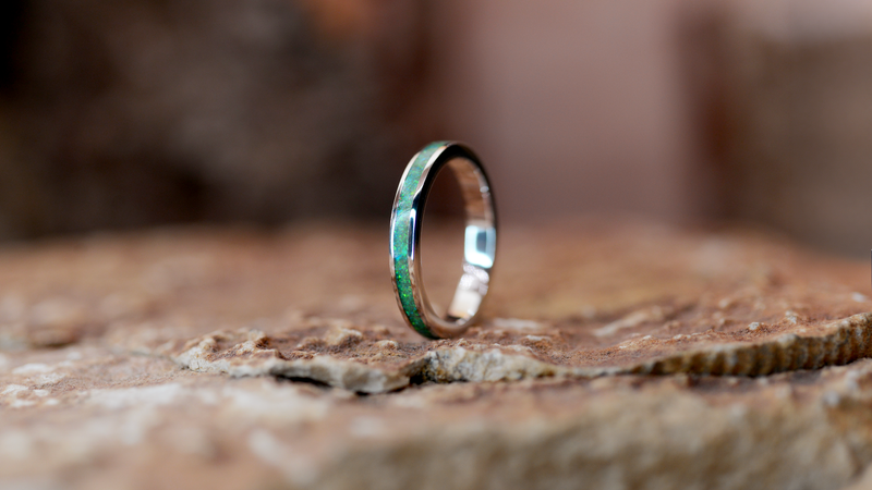 Circle Ashes Ring Cast in sterling silver filled with spring green opals blended with customers loved one’s ashes.