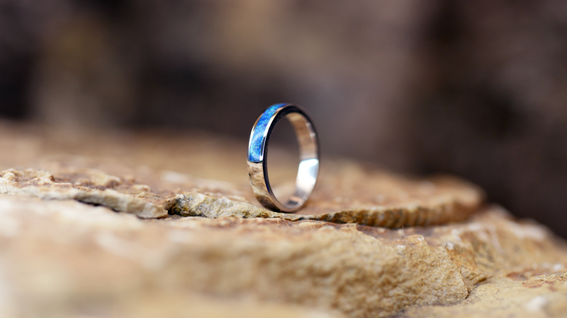 Half Circle Ashes Ring Cast in 9ct yellow gold filled with pacific blue opals blended with customers loved one’s ashes.