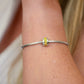 Opals & Ashes Memorial Charm modelled on Pandora bracelet. Sterling Silver with summer yellow opals blended with cremation ashes