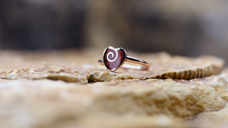 Spiral Heart Ladies Ashes Ring Cast in 9ct rose gold filled with ruby red opals blended with customers loved one’s ashes.