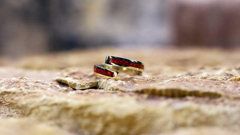 Spiral Ashes Ring Cast in 9ct yellow gold filled with ruby red opals blended with customers loved one’s ashes.