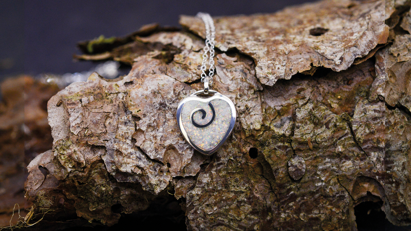 Spiral Heart Ashes Pendant. Cast in Sterling Silver, Filled with pearl white opals blended with customers loved one’s ashes.
