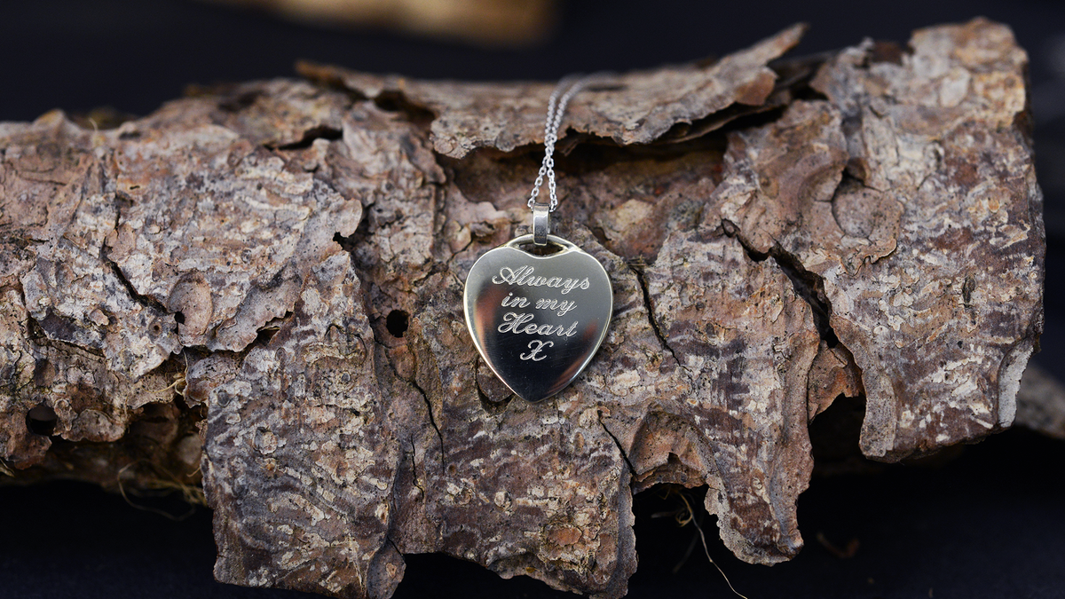 handmade ashes heart necklace UK cremation jewellery. Hand engraved
